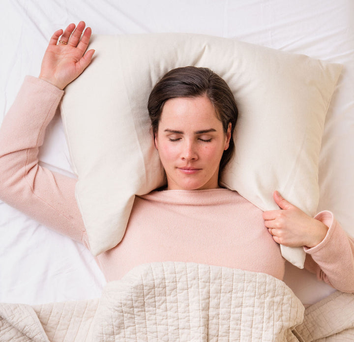 Woman laying on US made ComfyComfy buckwheat hull pillow