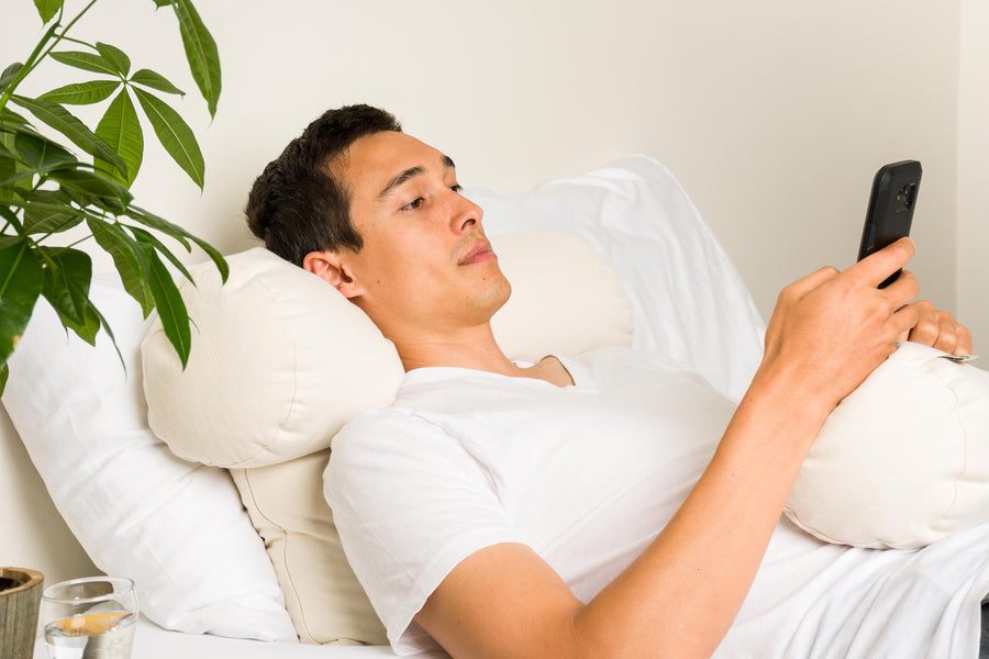 Man using ComfyComfy buckwheat hull ComfyNeck Pillow as neck support