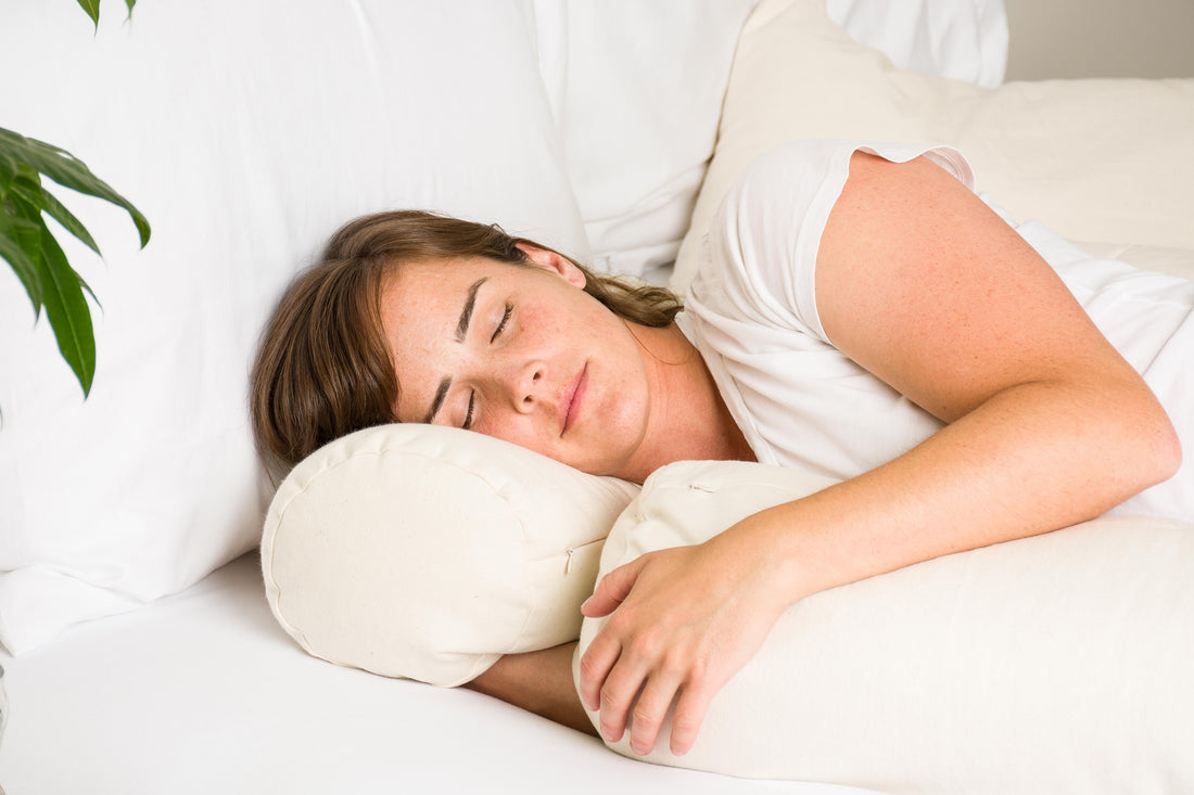 Woman sleeping with ComfyComfy buckwheat hull ComfyNeck Pillow